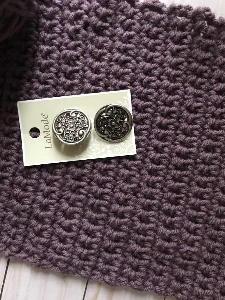 crochet purple yarn with silver button accents