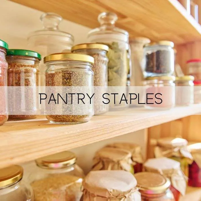 pantry spices on a shelf in clear glass containers