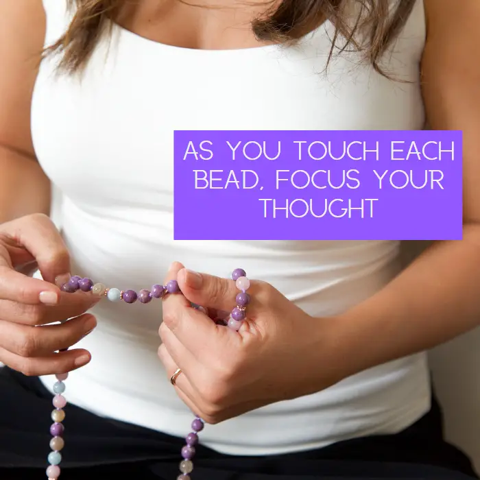 Woman holding a mala