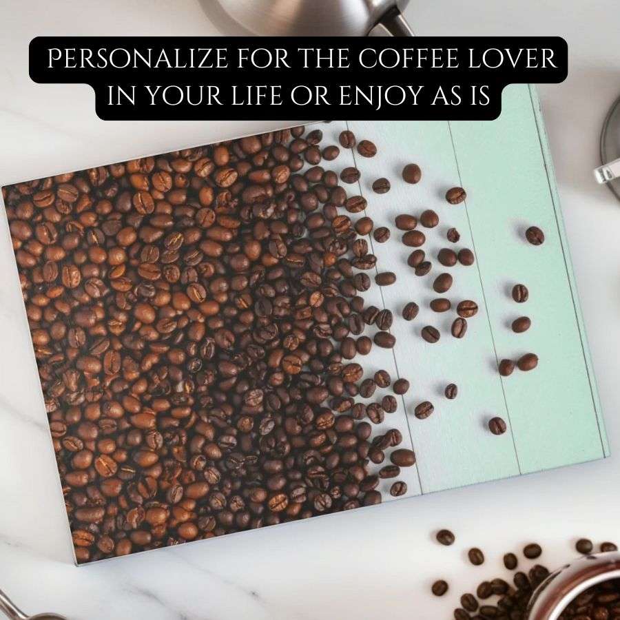 Glass cutting board on a marble counter. cutting board has roasted coffee beans flowing out onto a wood white table