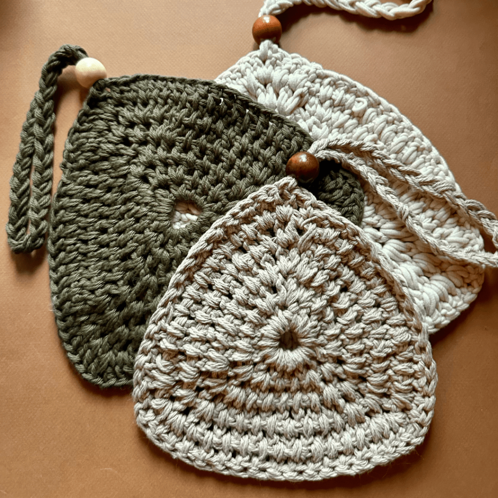 3 crochet trivets with a wood bead strap