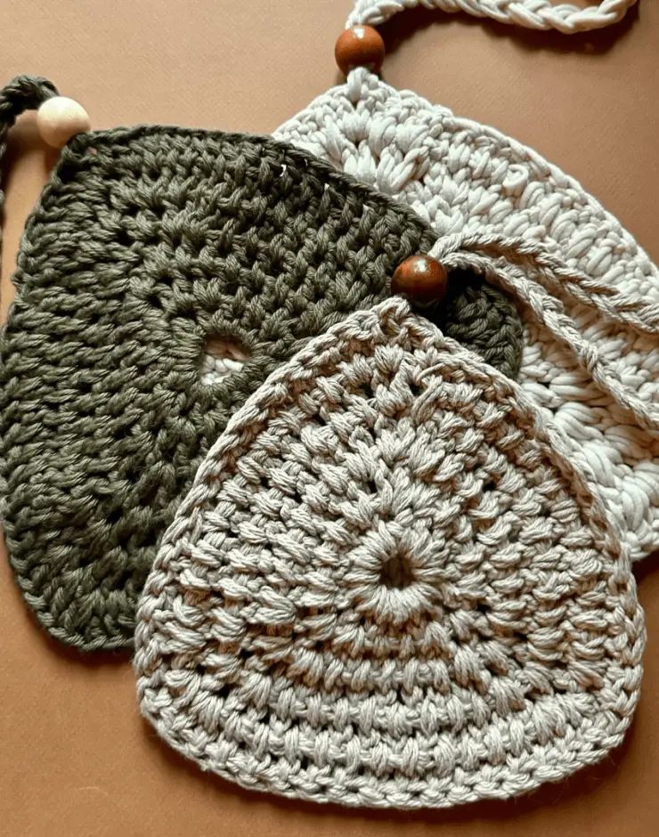 3 crochet trivets with a wood bead strap