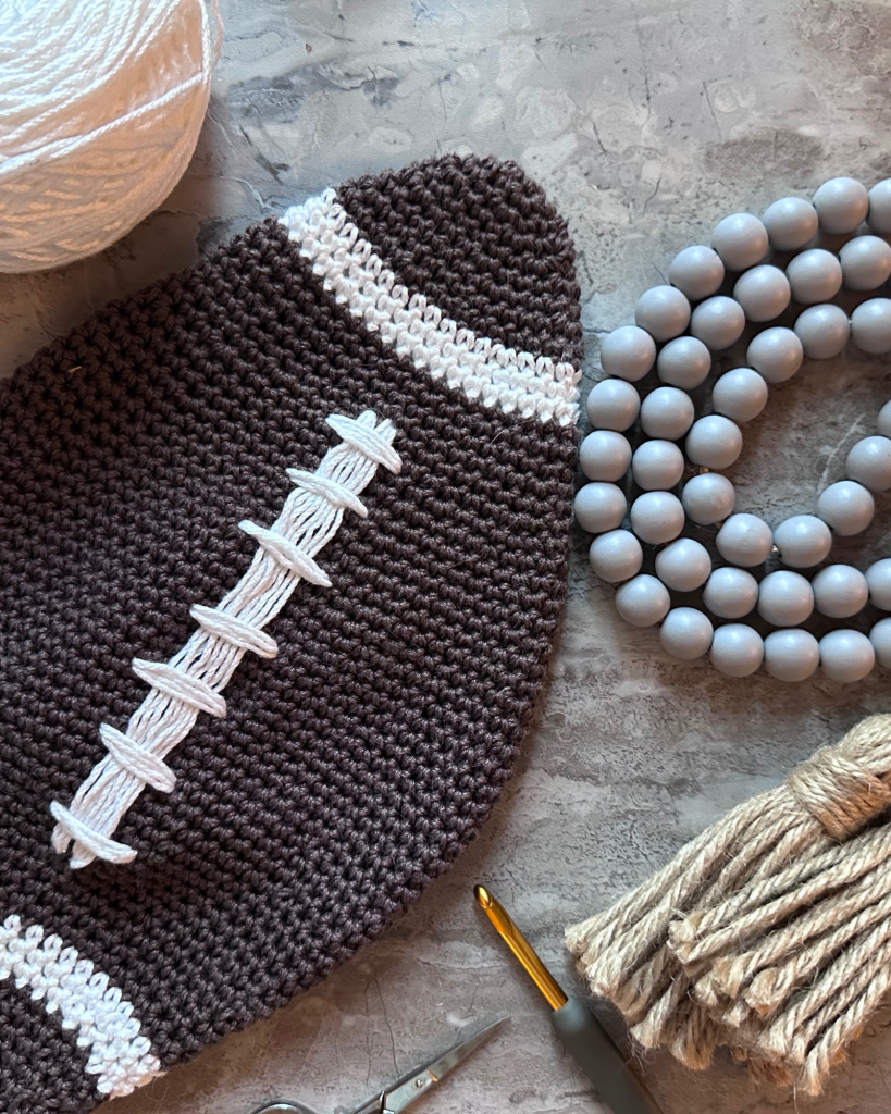 crochet  football with brown and white yarn